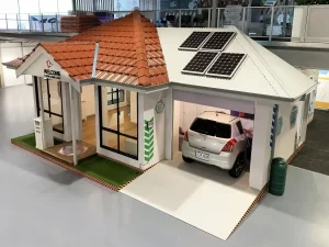 House display with exposed frame, open garage and roof section