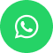 Green circle with white speech bubble containing a phone symbol, representing the WhatsApp logo. Simple and modern design.