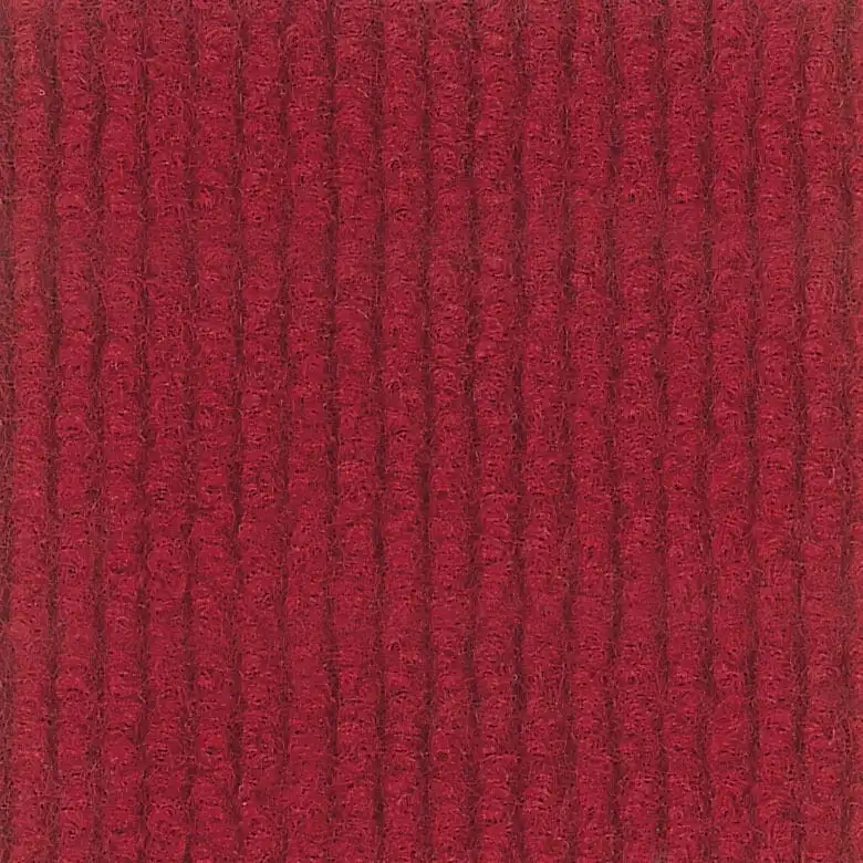 Red textured carpet fabric with a ribbed pattern, evoking a sense of warmth and softness. The regular vertical lines create a cozy and inviting appearance.