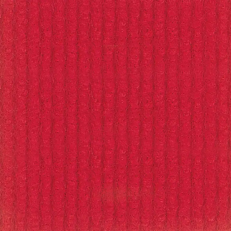 Detailed close-up of red carpet with vertical line design, showing plush texture and textured ribbed surface suitable for interior flooring.