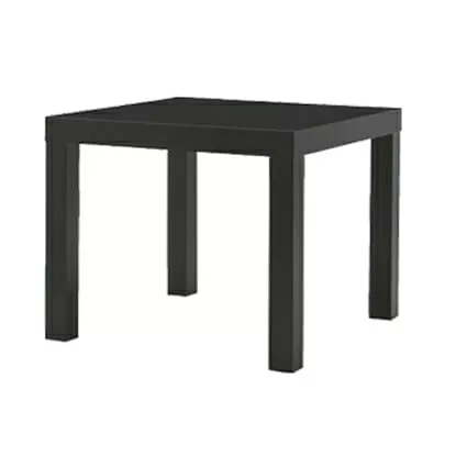 A simple black square table with four sturdy legs on a white background
