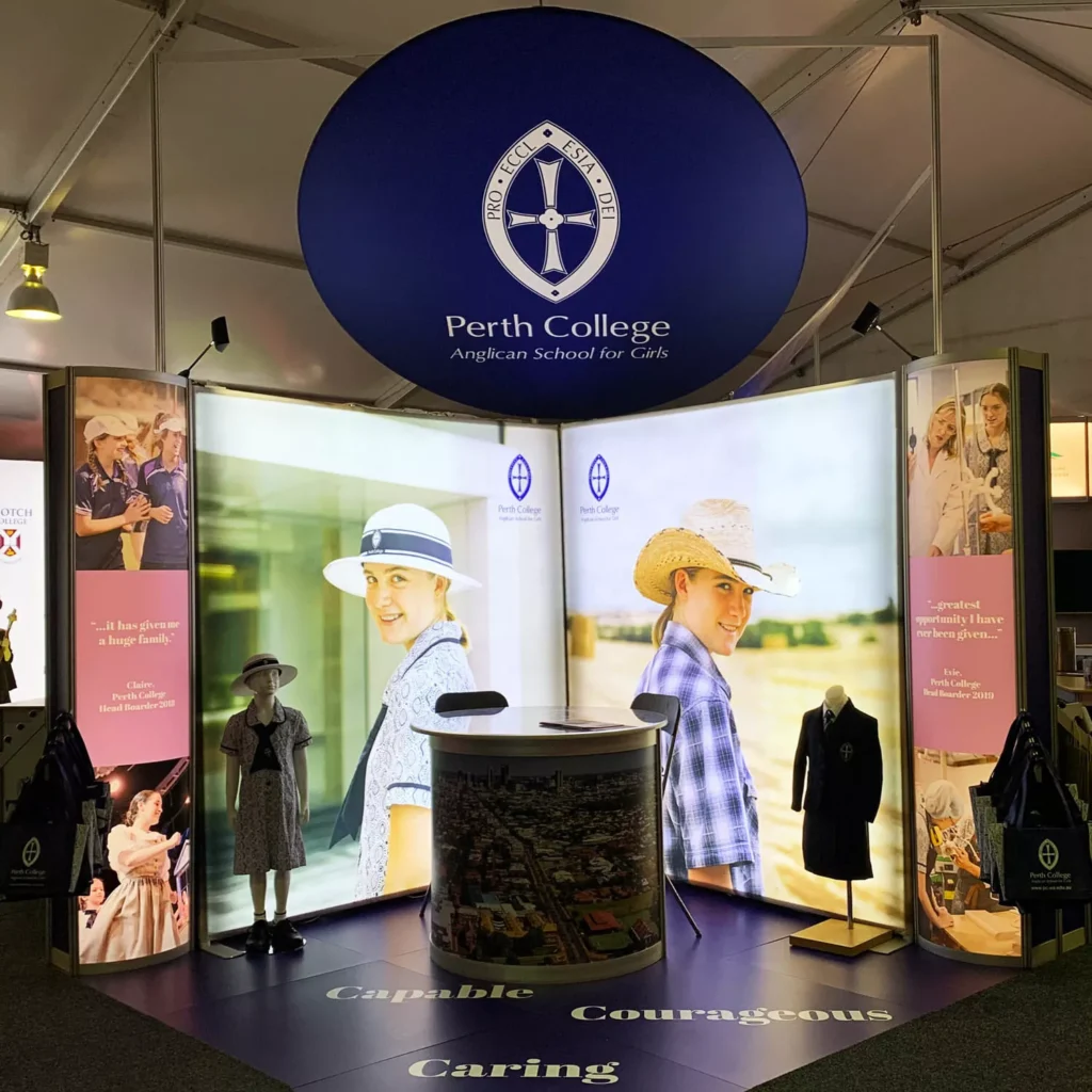Exhibition booth for Perth College featuring large images of smiling students in uniforms and sun hats.
