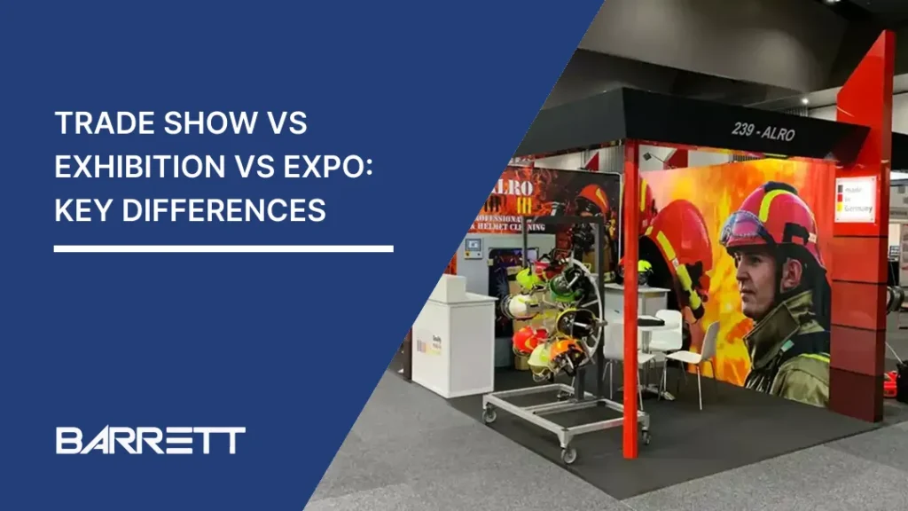 Booth at an exhibition featuring a vibrant display of firefighting gear and a large image of a firefighter, with bold text on blue background reading 'Trade Show vs Exhibition vs Expo: Key Differences'. The atmosphere is professional and informative.
