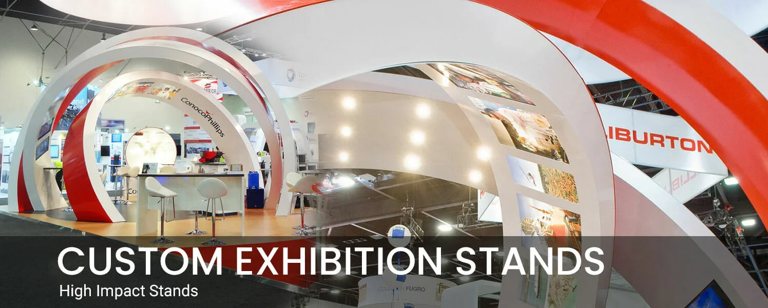 A sleek, modern exhibition stand with curved red and white arches, bright lighting, and seating. Text overlay reads "Custom Exhibition Stands."