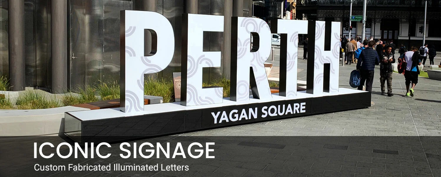 Illuminated letters spelling "PERTH" at Yagan Square, with people walking nearby. The text "ICONIC SIGNAGE: Custom Fabricated Illuminated Letters" is overlaid.