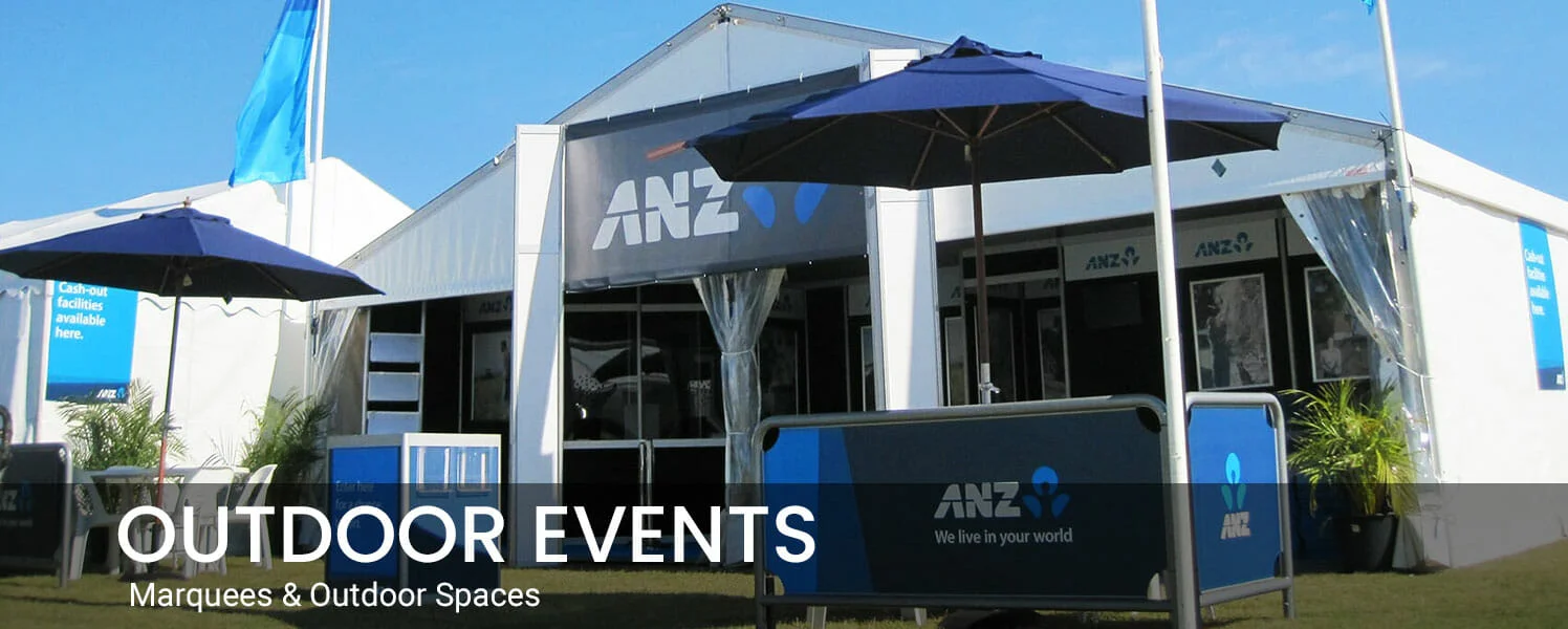 Outdoor events featuring marquees and outdoor spaces displayed in front of a tent with an ANZ sign.