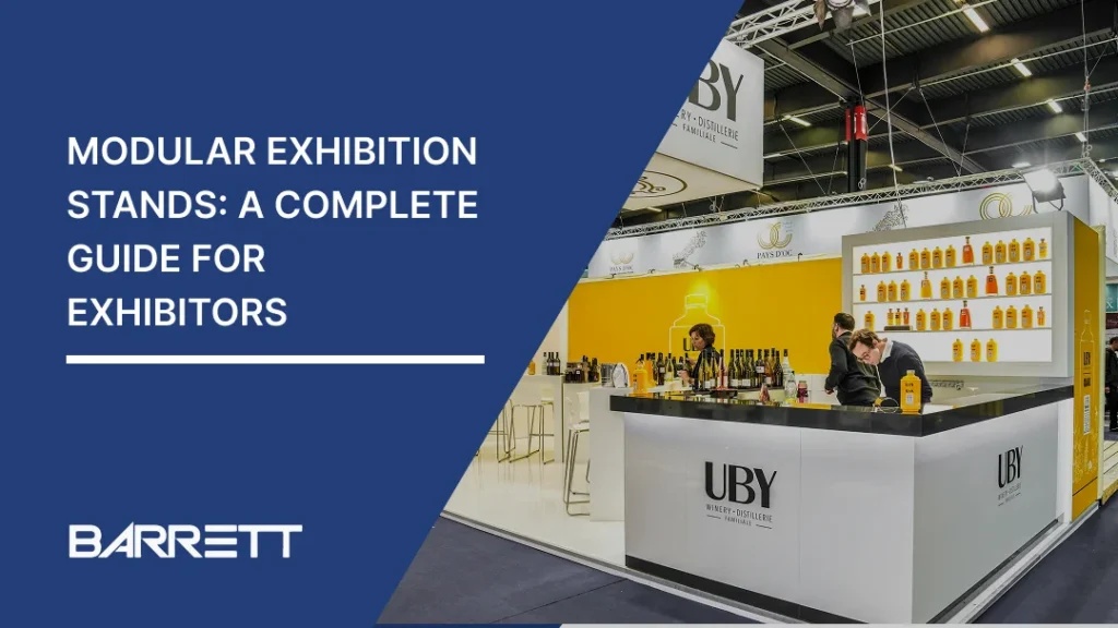 Thumbnail for a guide to modular exhibition stands, featuring a modern trade-show booth with a bar counter and product displays, alongside the title “Modular Exhibition Stands: A Complete Guide for Exhibitors” and Barrett branding.